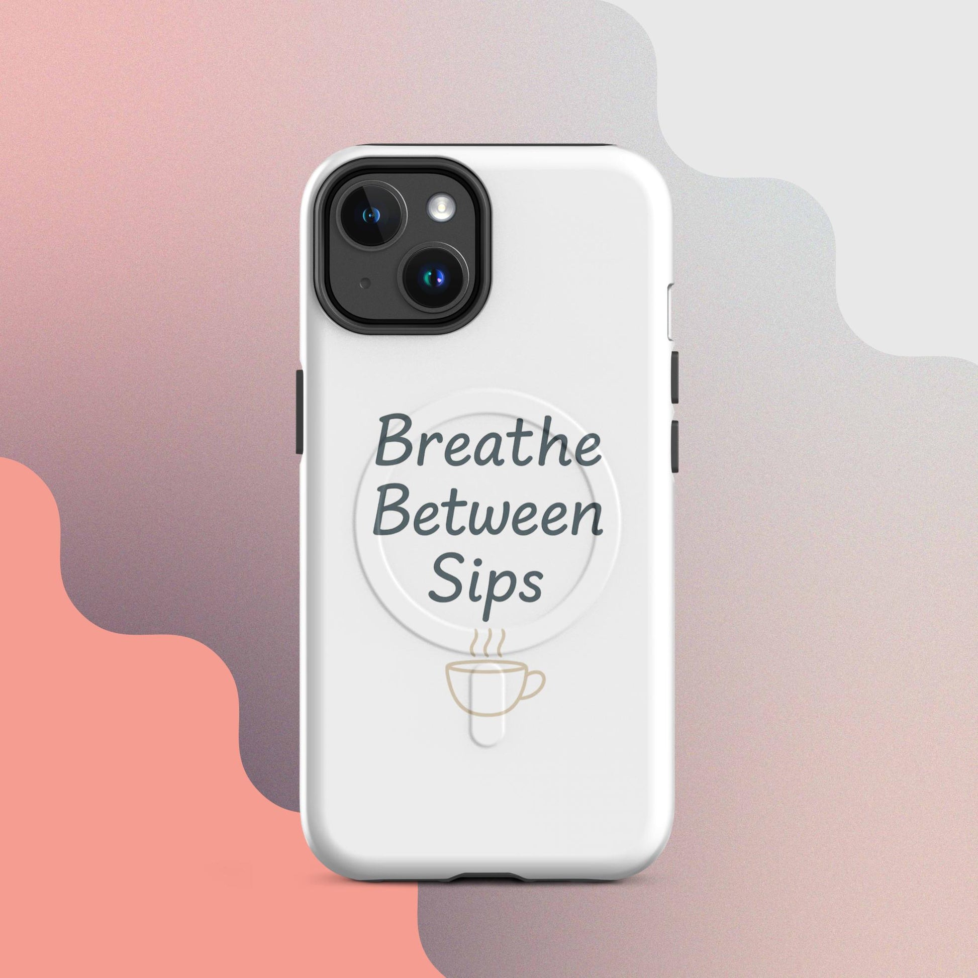 White MagSafe iPhone case with the phrase “Breathe Between Sips” and a minimal coffee cup illustration.
