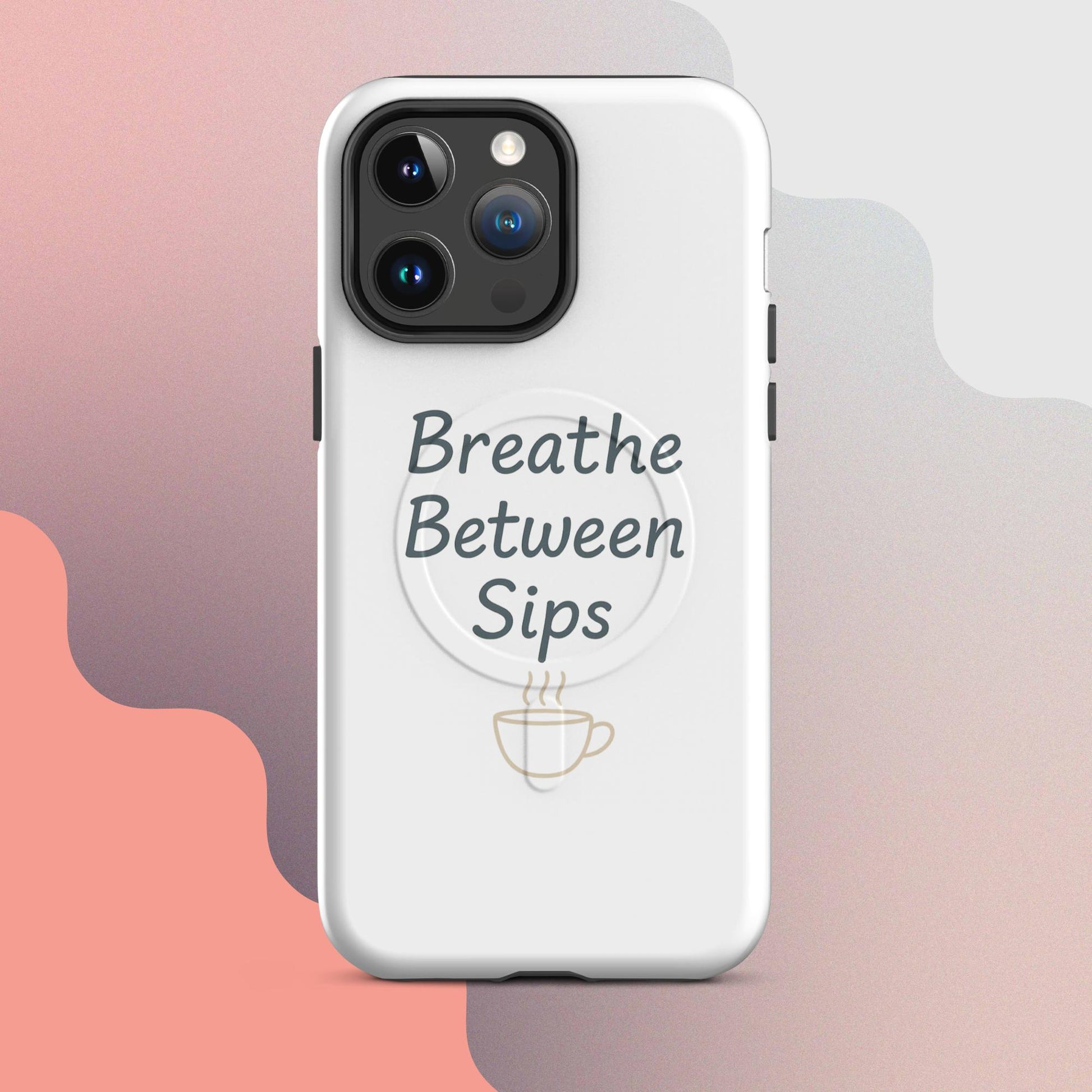 White MagSafe iPhone case with the phrase “Breathe Between Sips” and a minimal coffee cup illustration.
