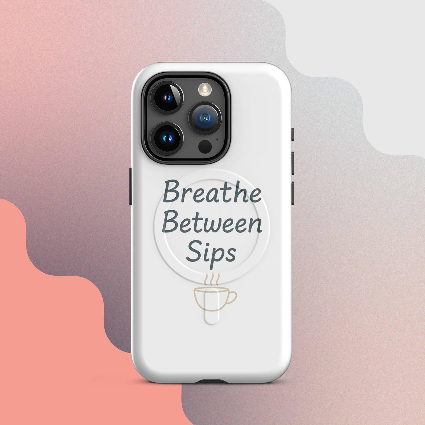 White MagSafe iPhone case with the phrase “Breathe Between Sips” and a minimal coffee cup illustration.
