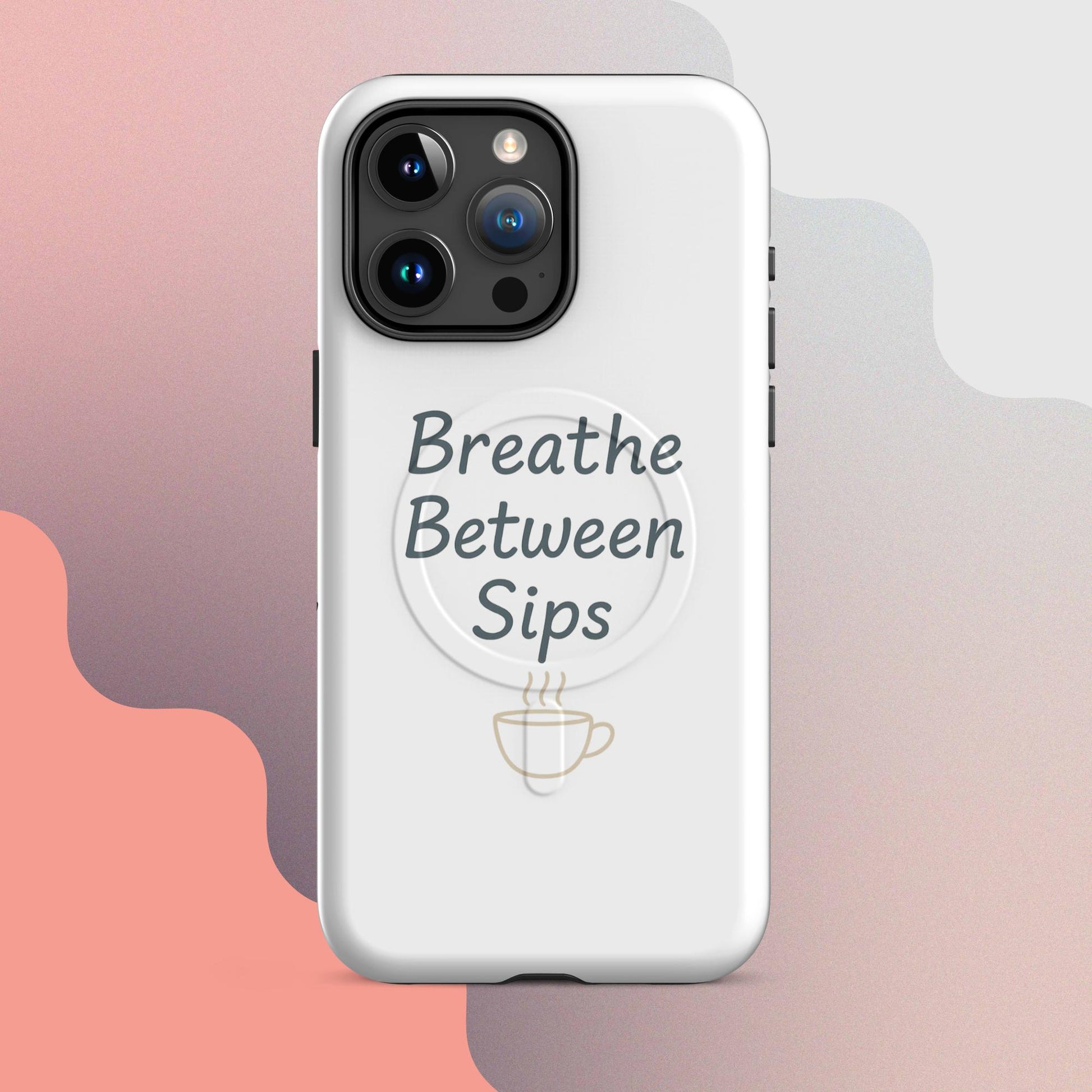 White MagSafe iPhone case with the phrase “Breathe Between Sips” and a minimal coffee cup illustration.
