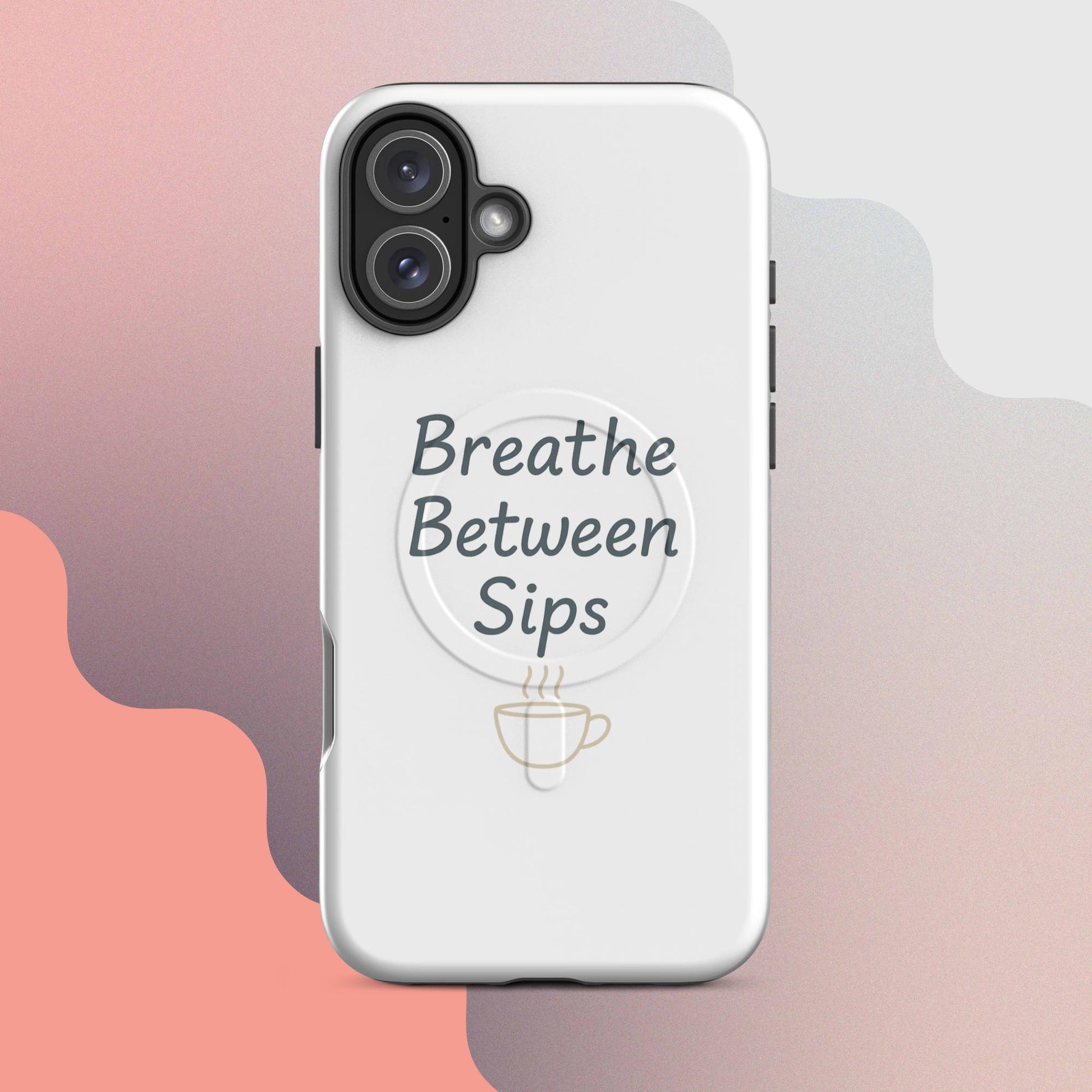 White MagSafe iPhone case with the phrase “Breathe Between Sips” and a minimal coffee cup illustration.
