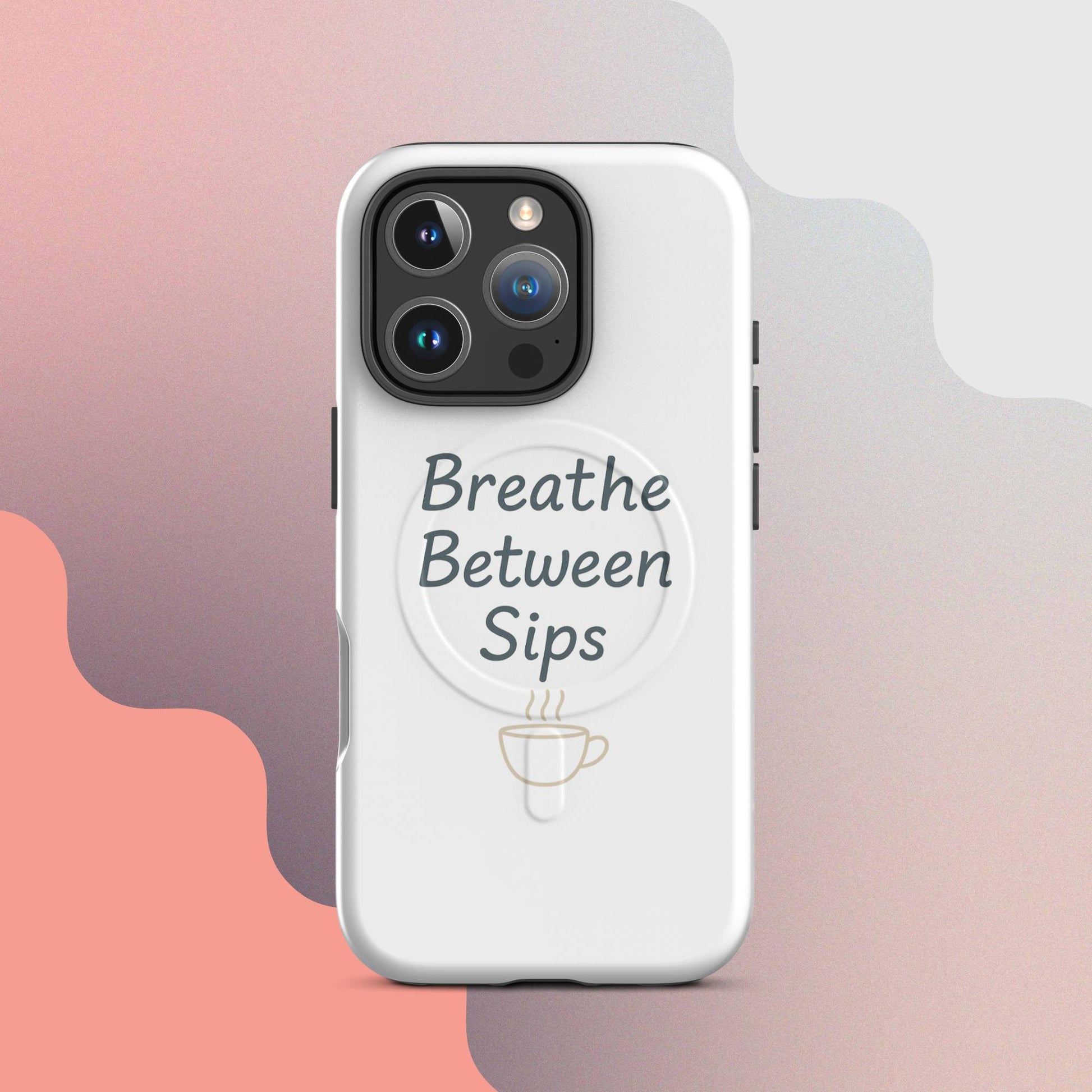 White MagSafe iPhone case with the phrase “Breathe Between Sips” and a minimal coffee cup illustration.
