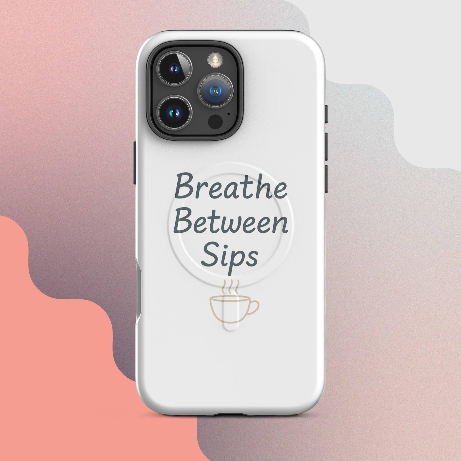 White MagSafe iPhone case with the phrase “Breathe Between Sips” and a minimal coffee cup illustration.
