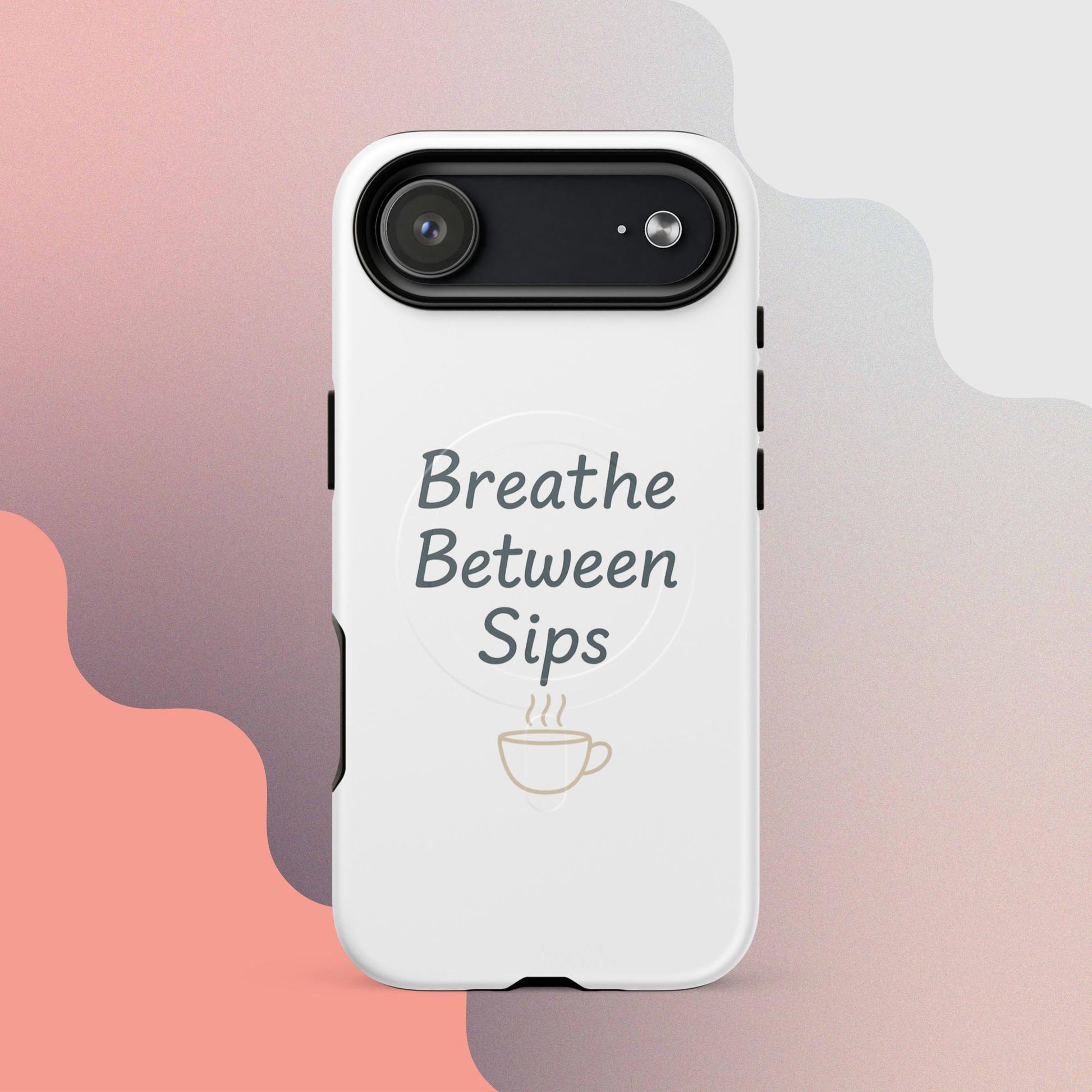 White MagSafe iPhone case with the phrase “Breathe Between Sips” and a minimal coffee cup illustration.
