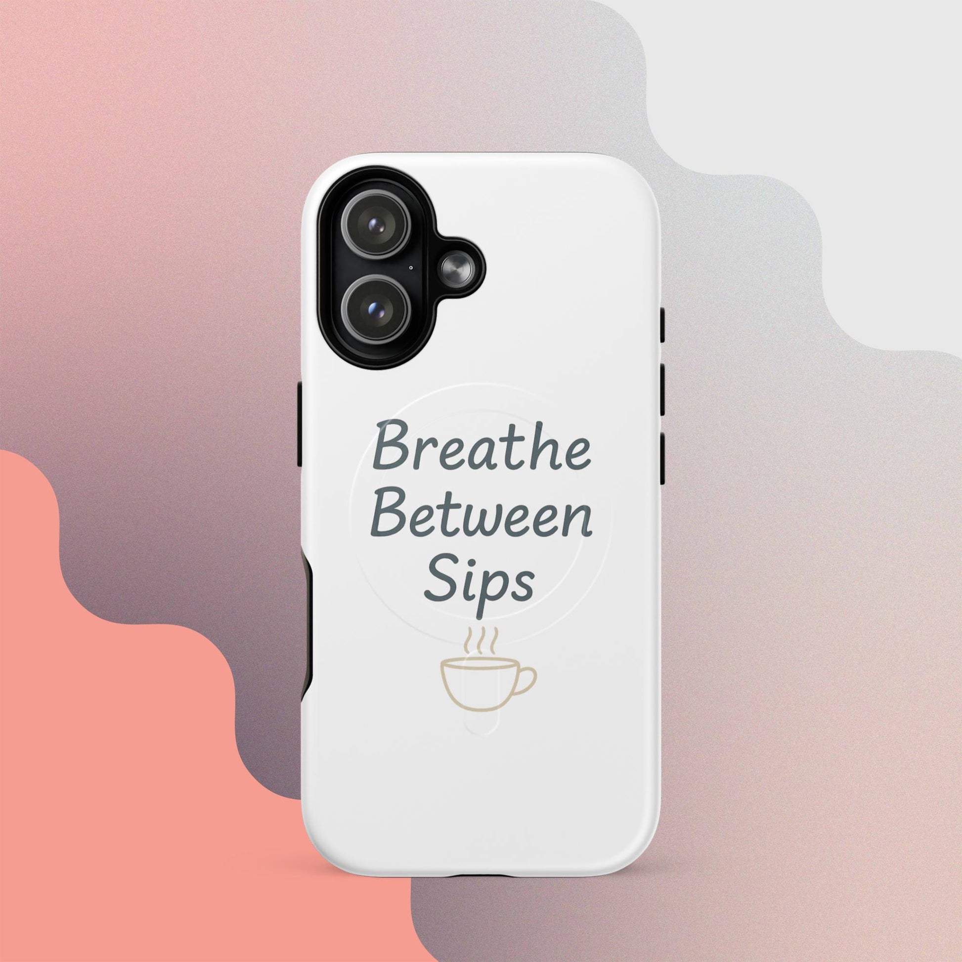 White MagSafe iPhone case with the phrase “Breathe Between Sips” and a minimal coffee cup illustration.
