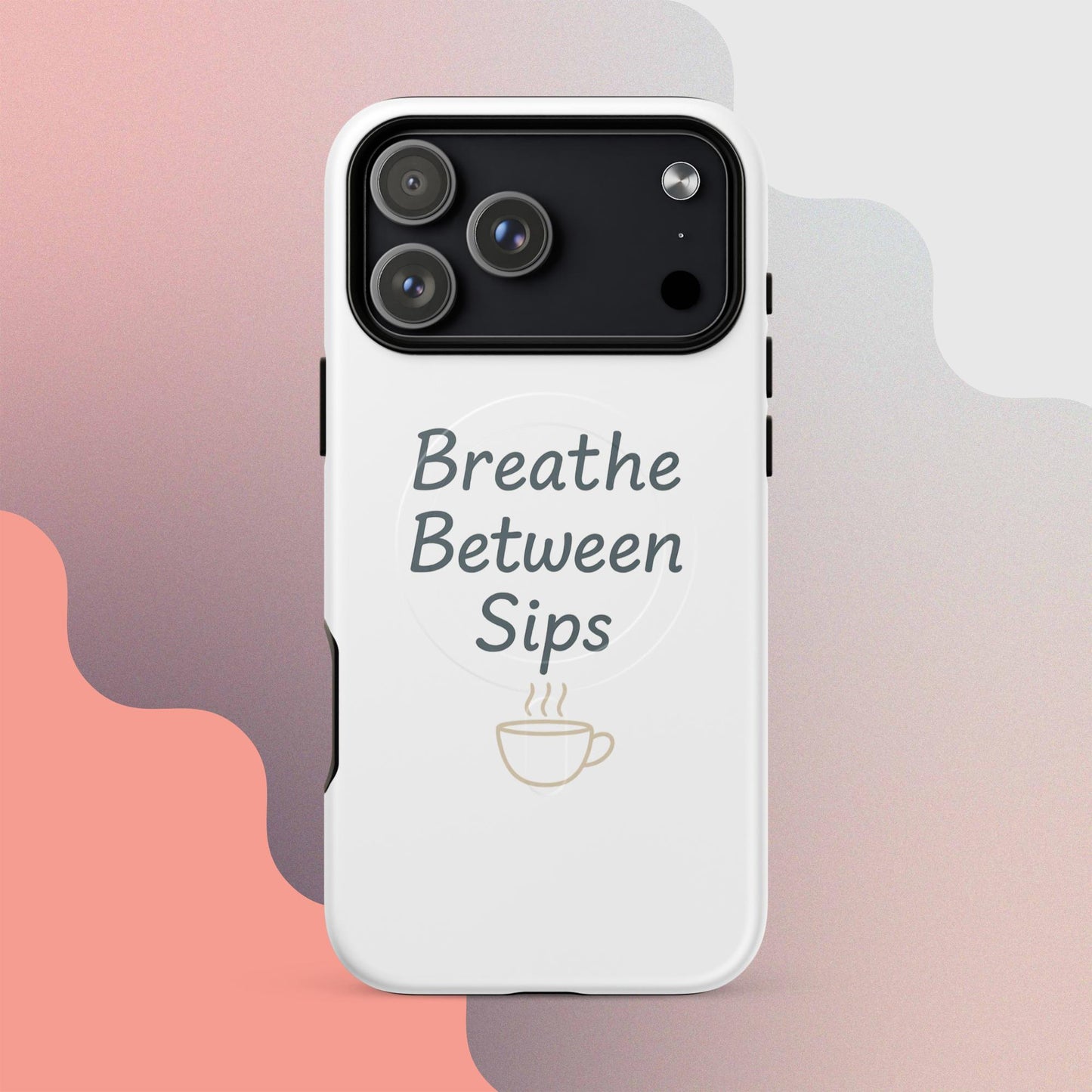 White MagSafe iPhone case with the phrase “Breathe Between Sips” and a minimal coffee cup illustration.
